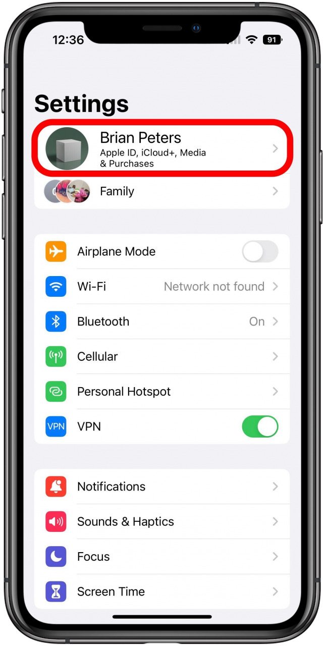 Settings app main screen with Apple ID option marked.